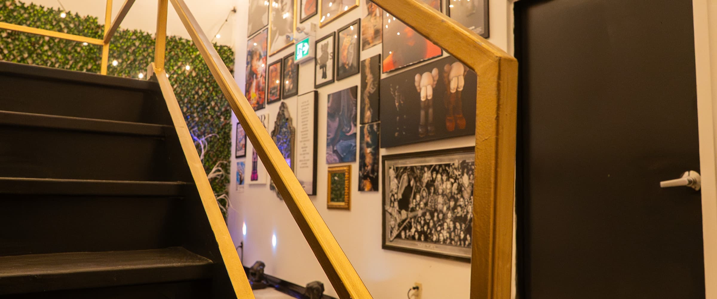 777 Lobby with gold handrails and gallery wall