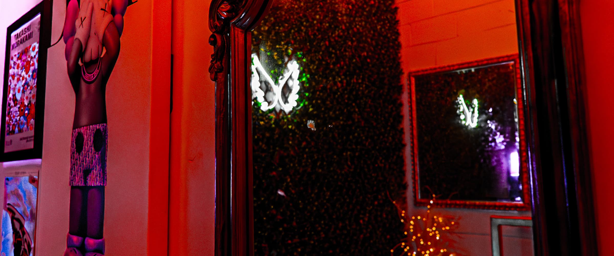 777 Lobby mirror wall under warm red wash