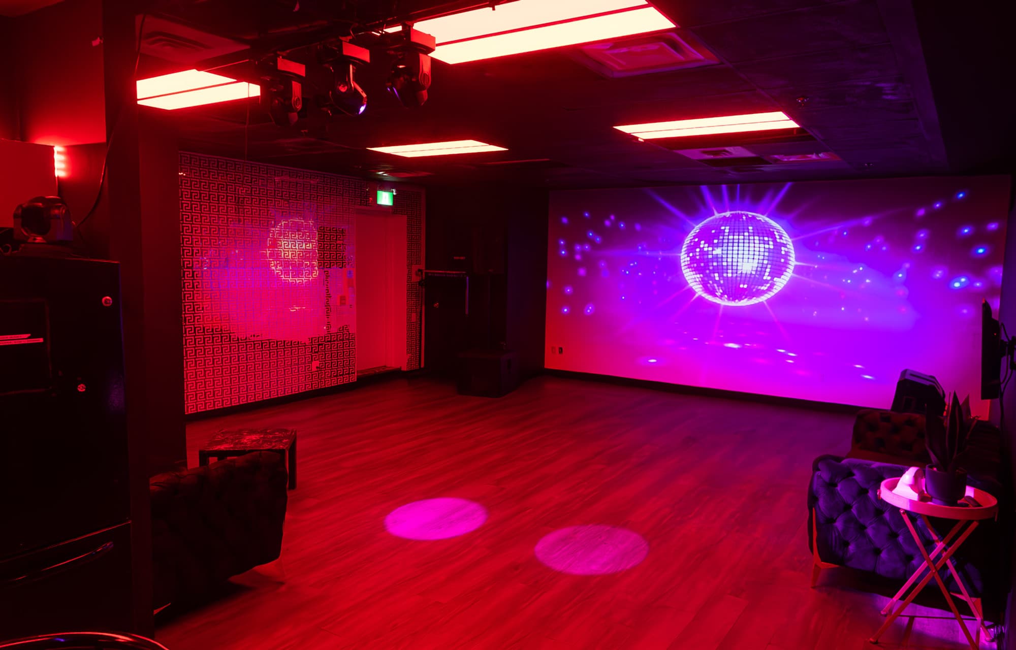 Lush Lounge event room — Versace wall, disco ball, immersive light